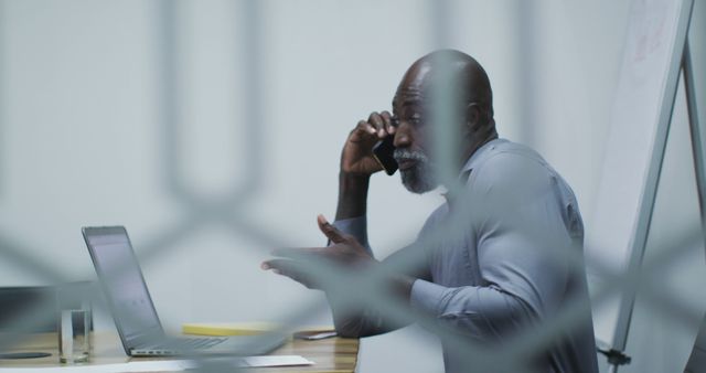 Professional Businessman Discussing on Phone in Modern Office - Download Free Stock Images Pikwizard.com