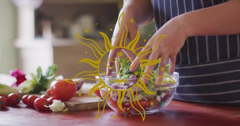 Hands creating fresh vegetable salad in rustic kitchen
