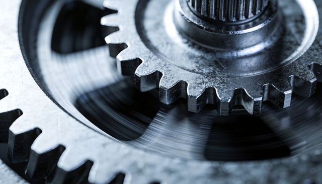 Macro meshing steel gears in running gearbox with oil film and splined shaft