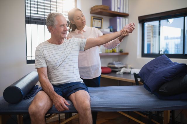 This image can be used in healthcare and medical contexts, such as articles about elderly care, physical therapy, and patient rehabilitation. It is suitable for illustrating medical consultations, doctor-patient interactions, and healthcare services for seniors.