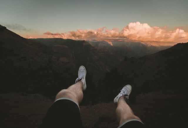 Dangling Feet Over Canyon at Sunset - Download Free Stock Images Pikwizard.com