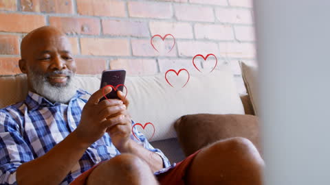 Smiling Older African American Man Texting with Heart Animation