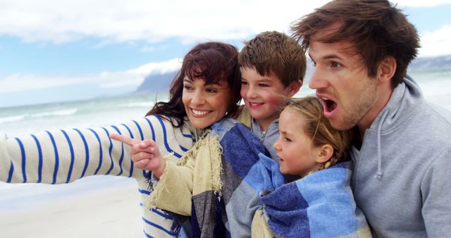 Happy Family Enjoying Day at Beach in Winter - Download Free Stock Images Pikwizard.com