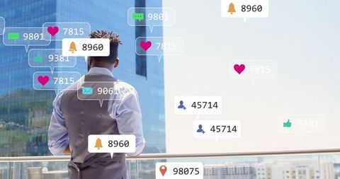 Man engaging with social media notifications on modern balcony