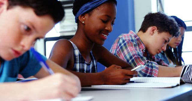 Diverse Students Studying and Texting in Classroom - Download Free Stock Images Pikwizard.com