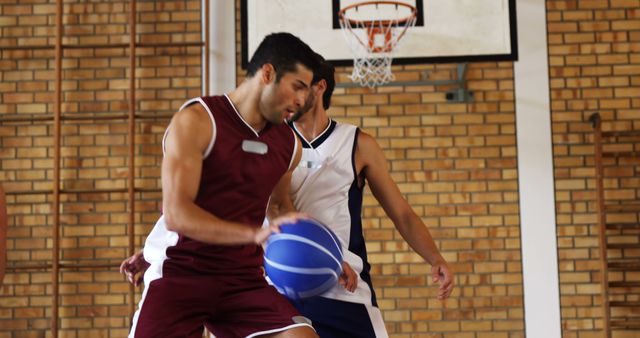 Basketball Players in Action at Indoor Court - Download Free Stock Images Pikwizard.com