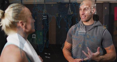 Trainer explaining workout with ar technology in gym