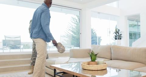 Friends homecoming entering cozy modern living room