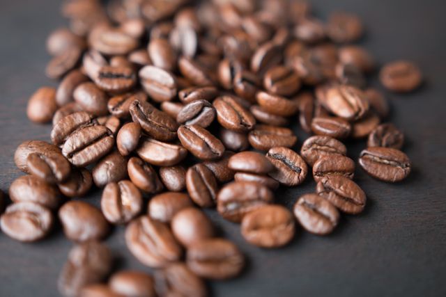 Macro Shot of Roasted Coffee Beans on Dark Background - Download Free Stock Photos Pikwizard.com