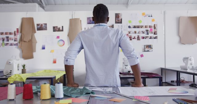 Fashion Designer Working in Studio Facing Inspiration Board - Download Free Stock Images Pikwizard.com