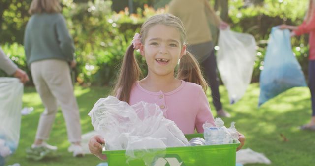 Image portrait of smiling caucasian girl collecting plastic for recycling with family outdoors. Family, domestic life, togetherness, recycling and waste concept digitally generated image.