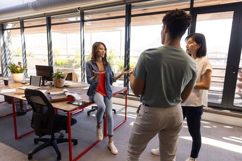 Team Collaborating Creatively in Modern Open-Plan Office Space