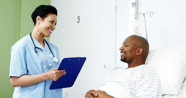 Nurse discussing medical report with patient in hospital room - Download Free Stock Images Pikwizard.com