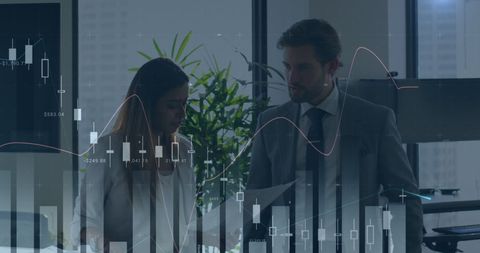 Professionals Analyzing Financial Graphs in Office Setting - Download Free Stock Images Pikwizard.com