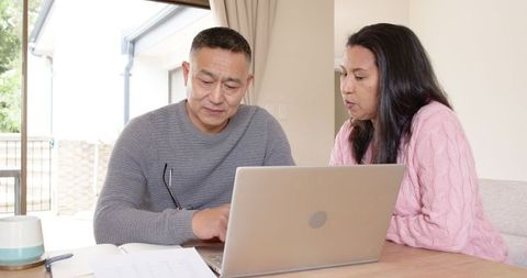 Diverse Couple Planning Finances Together at Home