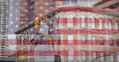 Diverse american culture: woman in hijab enjoying food in urban setting