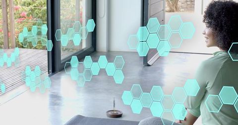 Meditating woman on mat by glass doors with teal hexagon overlays and incense