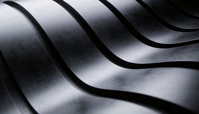 Flowing metallic wave pattern with curved corrugated ridges and reflective texture