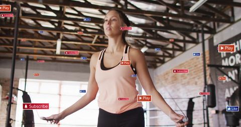 Woman Jumproping in Gym Surrounded by Social Media Icons