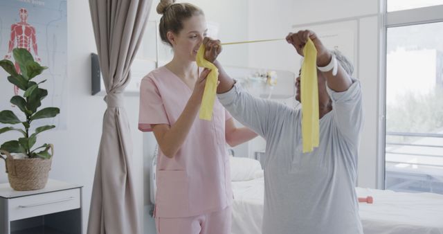 Physical Therapist Assisting Patient with Resistance Band Exercises in Clinic - Download Free Stock Images Pikwizard.com