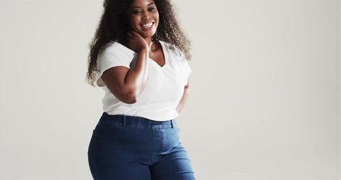 Confident African American Woman Smiling in Casual Fashion