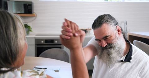 Senior Couple Engaging in Financial Planning Conversation