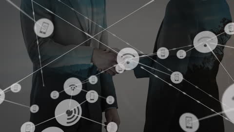 Business Partners Shaking Hands Over Digital Network Interface