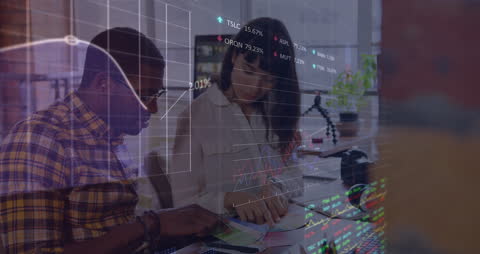 Team Analyzing Financial Data at Modern Office Desk