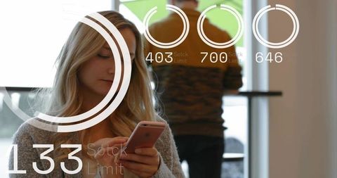 Scrolling woman using smartphone in modern cafe with futuristic hud overlays
