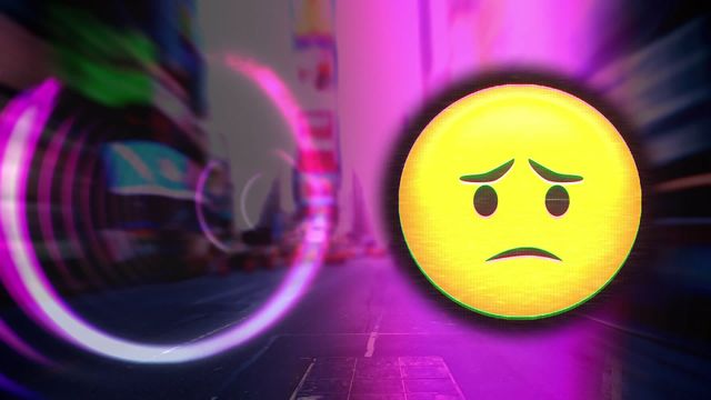 Image combines a visually striking sad emoji with a glowing effect overlaid on a vibrant, blurry cityscape. The contrast of modern city elements with the digital, symbolic face explores communication in virtual spaces, suitability for discussions on emotions, online communication, social media themes, or futuristic digital impressions.