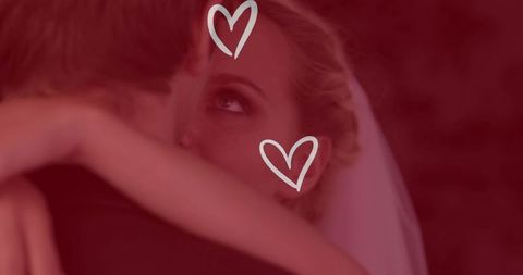 Romantic Wedding Dance with Hearts Overlay Symbolizing Love