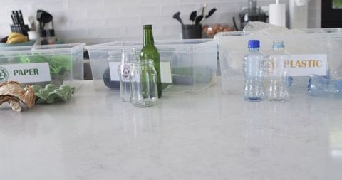 Kitchen Countertop Recycling Setup with Clear Bins for Sustainability