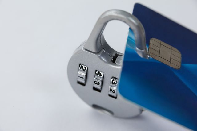Close-up of a smart card secured with a combination lock, symbolizing data protection and financial security. Useful for illustrating concepts related to cybersecurity, digital safety, and secure transactions.