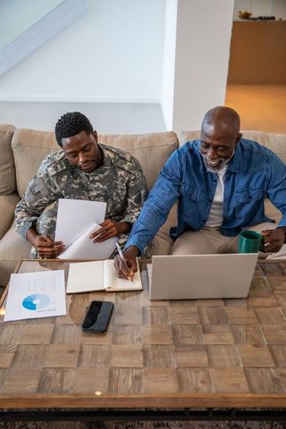 Father and Son Collaborative Review in Rustic Home Environment