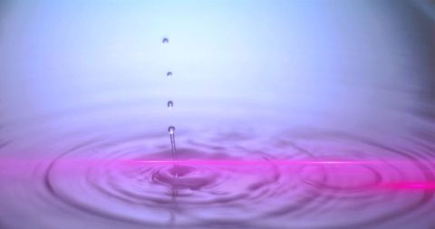 Serenity of Water Droplet with Neon Reflection on Liquid Surface - Download Free Stock Images Pikwizard.com
