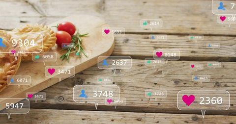 Displaying rustic board of savory pies and herbs with floating social engagement icons