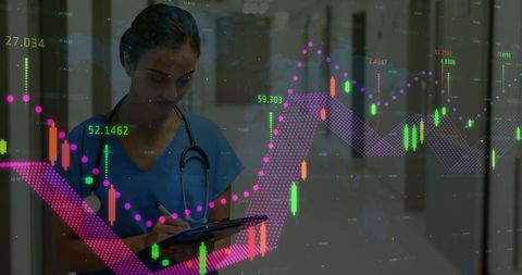 Nurse assessing financial data in hospital corridor