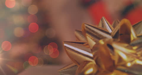 Golden Bow with Holiday Bokeh in Background