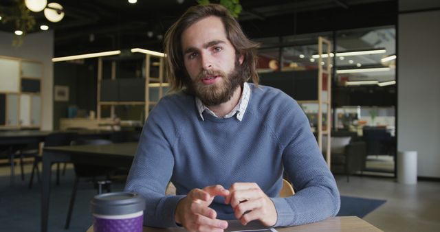 Young Bearded Man Having Conversation in Modern Office Space - Download Free Stock Images Pikwizard.com