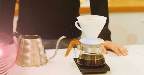 Artisan pour-over coffee brewing with gooseneck kettle