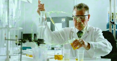 Senior Scientist Pipetting Yellow Reagent with Neon-Green Glow in Research Laboratory