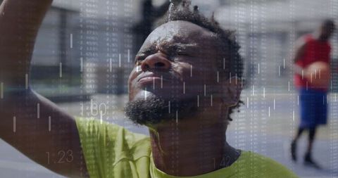 Athletic man cooling down outdoors with financial overlay