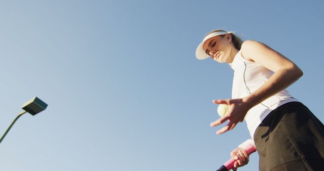 Female Tennis Player Preparing to Serve on Sunny Day - Download Free Stock Images Pikwizard.com