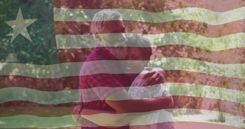 Mature couple hugging and kissing with american flag overlay, garden patriotism and warmth