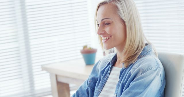 Smiling Blonde Woman Working on Laptop in Bright Office - Download Free Stock Images Pikwizard.com