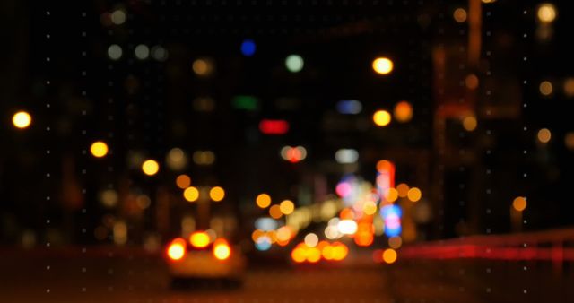 Blurred city street view at night with colorful bokeh lights from buildings and cars. Useful for urban background, nightlife concepts, web design, or creative projects involving metropolitan atmospheres.