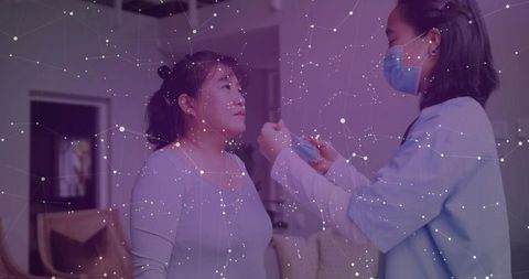 Home Healthcare Professional Assisting Patient with Surgical Mask