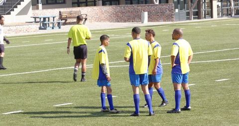 Teen Soccer Players Communicating During Practice Match