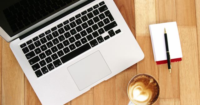 Laptop Keyboard with Notepad and Latte on Wooden Desk - Download Free Stock Images Pikwizard.com