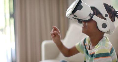 Young Boy Experiencing Virtual Reality with VR Headset